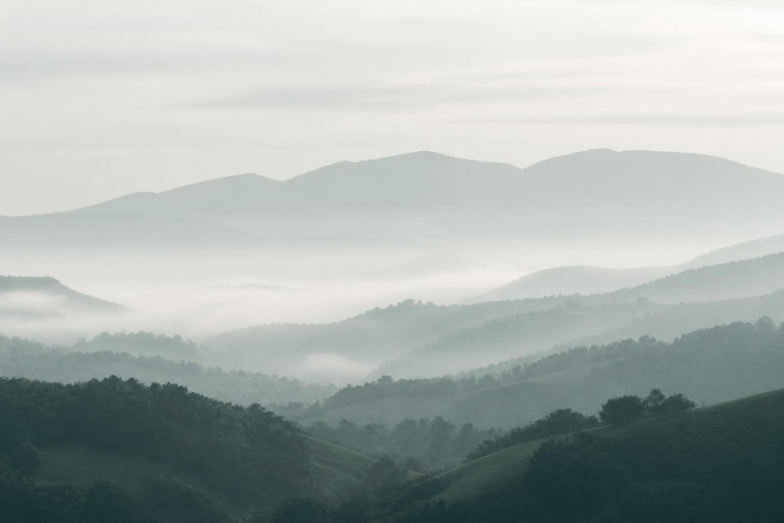 Layers of Perthshire hills fading into morning mist